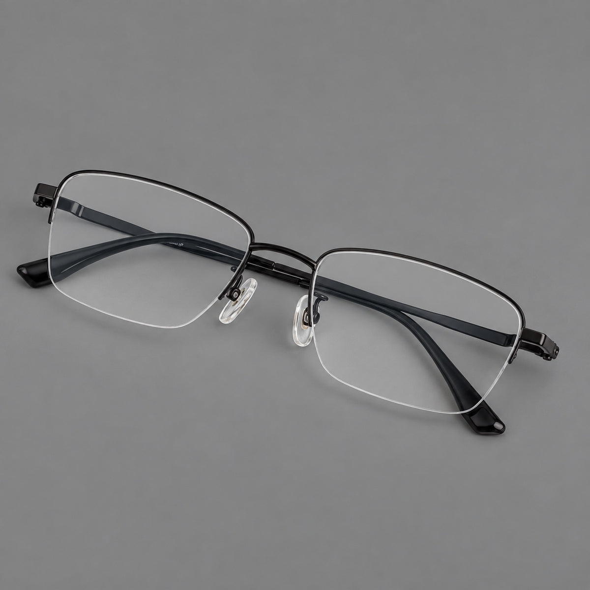 Half frame titanium glasses with rectangular lenses and rounded hinge details in Black, three quarter view