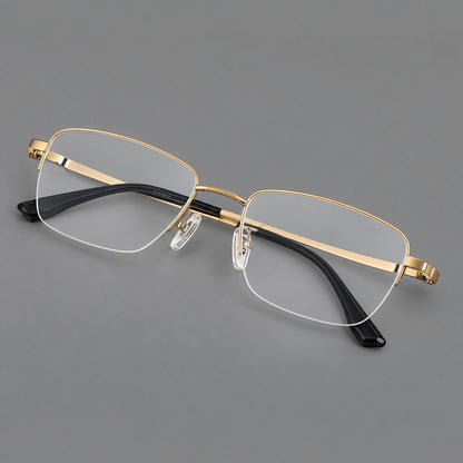 Half frame titanium glasses with rectangular lenses and rounded hinge details in Gold, three quarter view lens detail