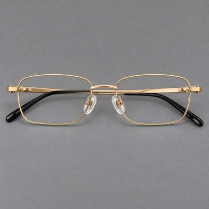 Shallow rectangular titanium glasses with a broad bridge and stepped temple joins in Gold, front view temple detail