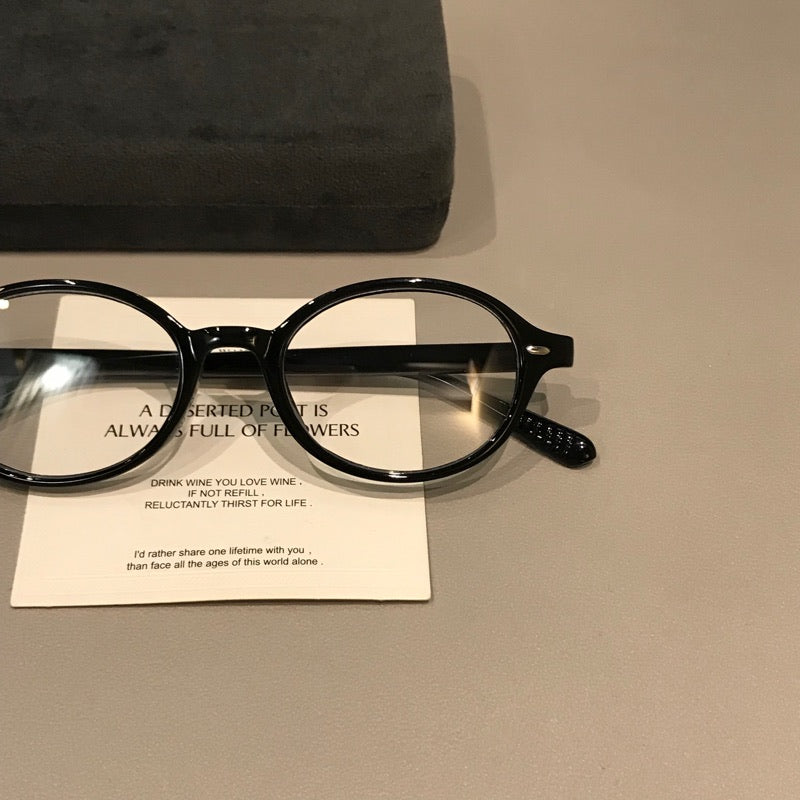 Retro Round Eyeglass Frames with Thick Rims and a Raised Bridge, Black side view
