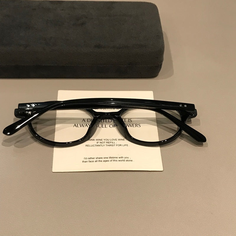 Retro Round Eyeglass Frames with Thick Rims and a Raised Bridge, Black front view