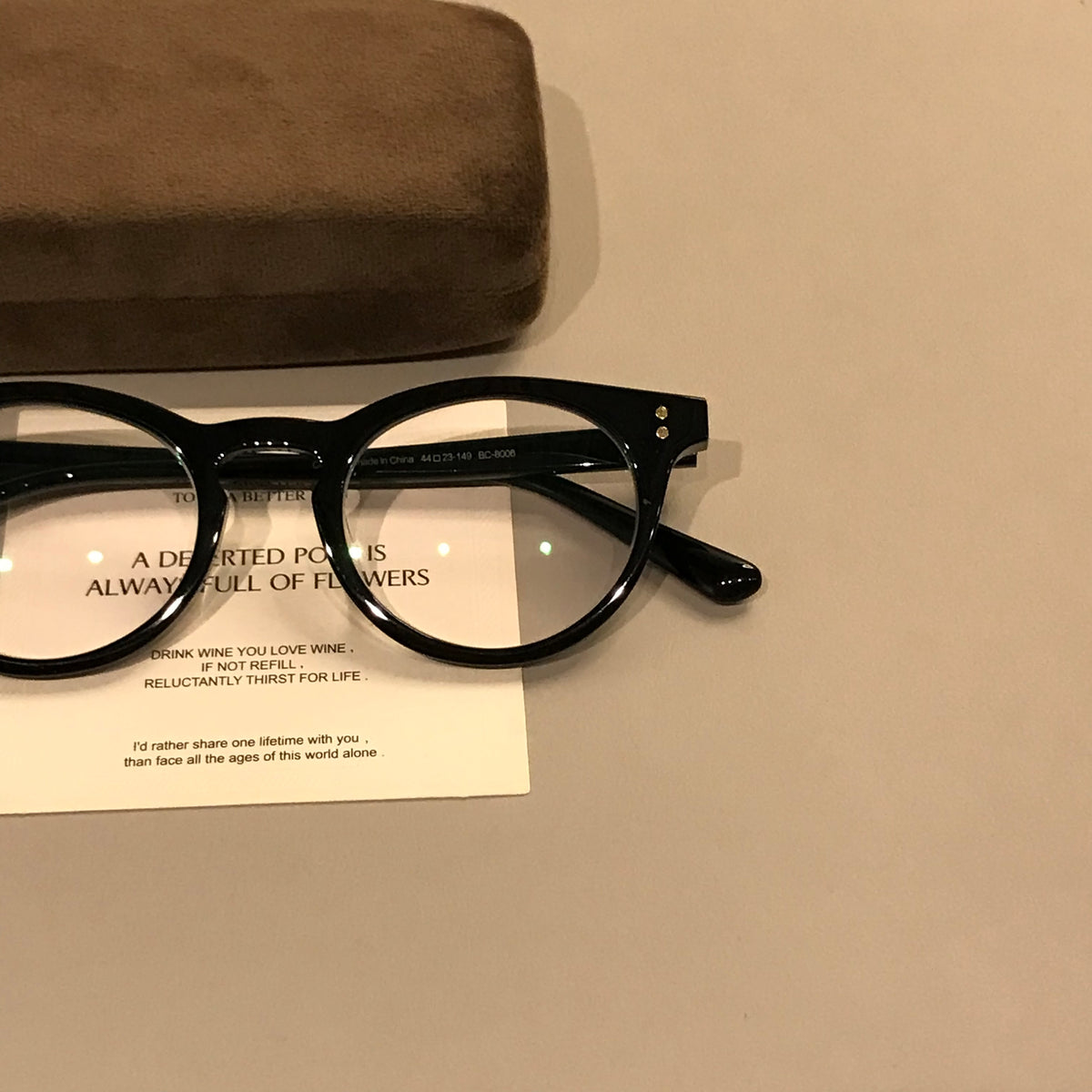 Compact Oval Eyeglass Frames with Thick Rims, Black or Tortoiseshell temple detail