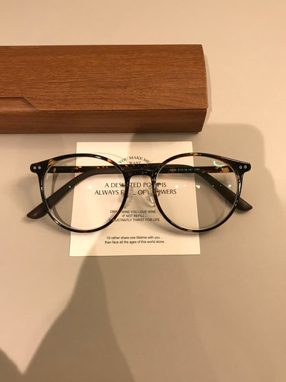 Retro Rounded Eyeglass Frames with a Raised Bridge, Tortoiseshell and lens detail
