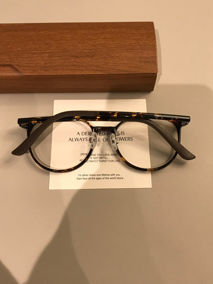 Retro Rounded Eyeglass Frames with a Raised Bridge, Tortoiseshell and temple detail