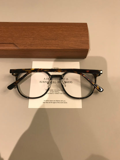 Rounded Square Eyeglass Frames with a Raised Brow, Amber Tortoiseshell temple detail
