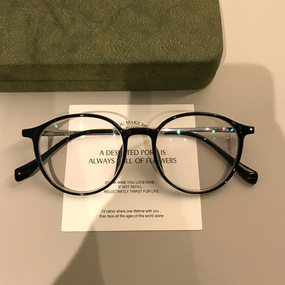 Round Eyeglass Frames with a Keyhole-Style Bridge, Black or Transparen