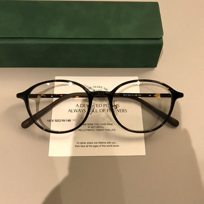 Round Eyeglass Frames with Broad Temples and Corner Studs, Black, Tort lens detail