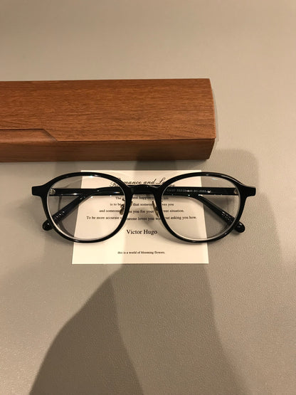 Oval Eyeglass Frames with a Thick Upper Rim, Black, Burgundy or Tortoi frame detail